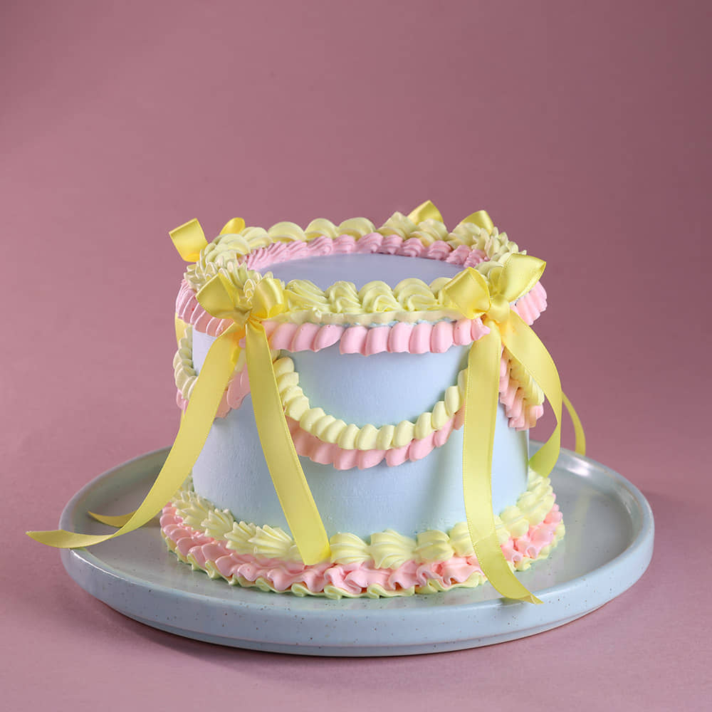 Front Angled View of Pastel Wrap Ribbon Cake