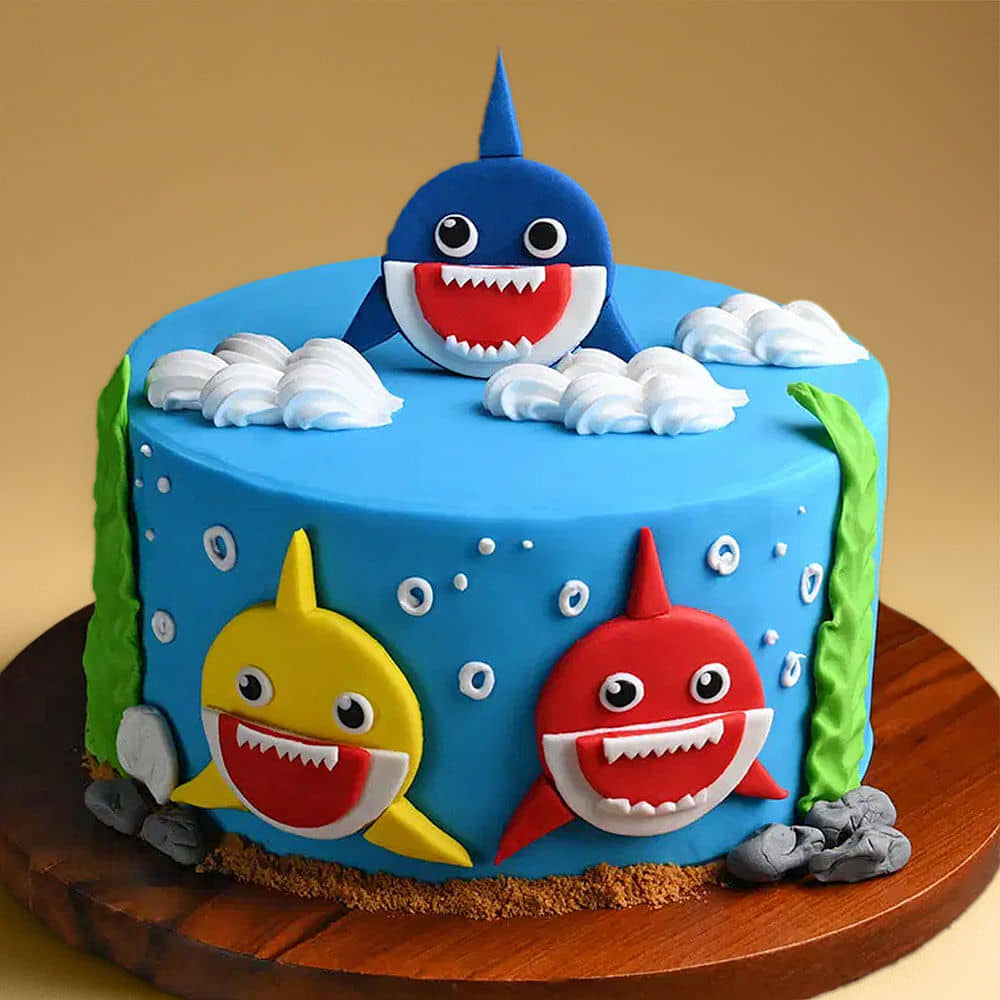 Zoomed-In View of Smiling Baby Sharks Fondant Cake