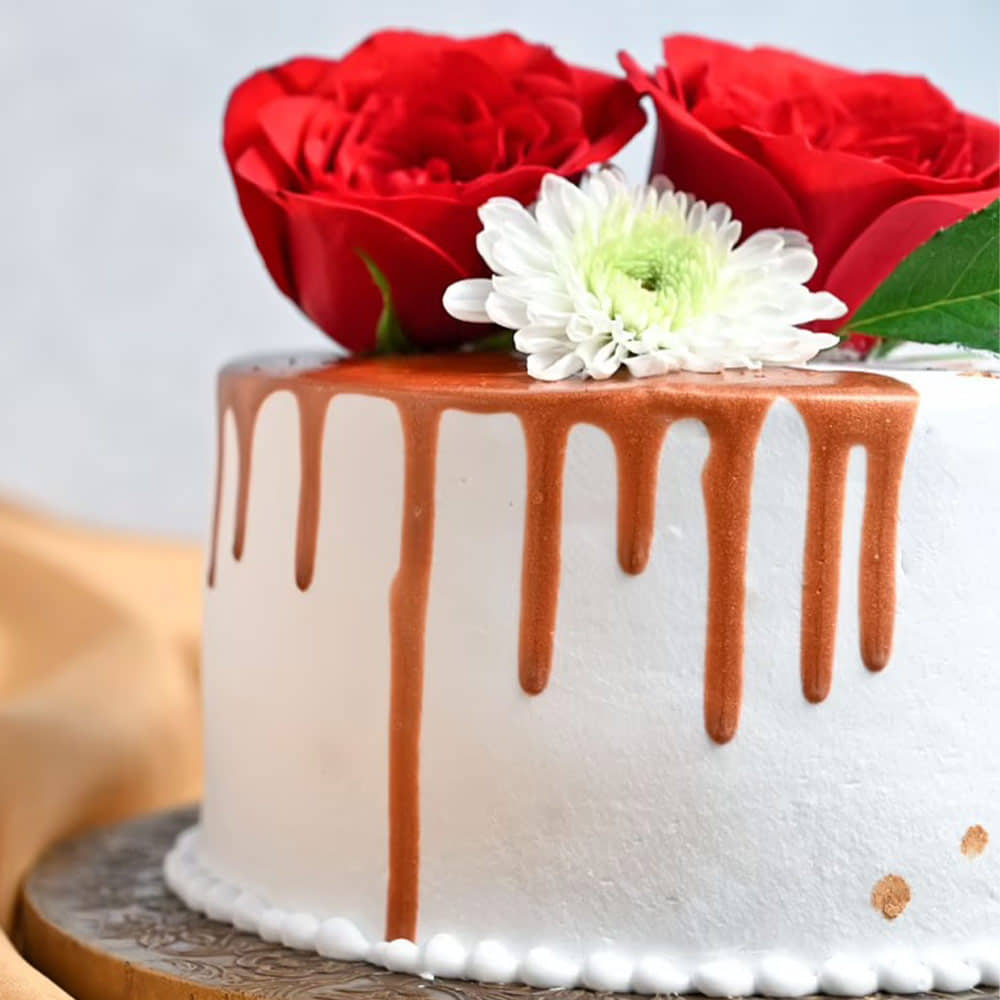 Side View Round Drooling Vanilla Rose Cake
